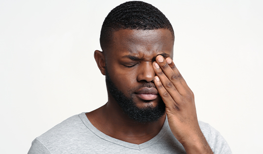 Men suffering eye injury