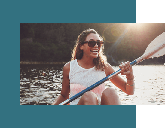 woman with sunglasses canoeing