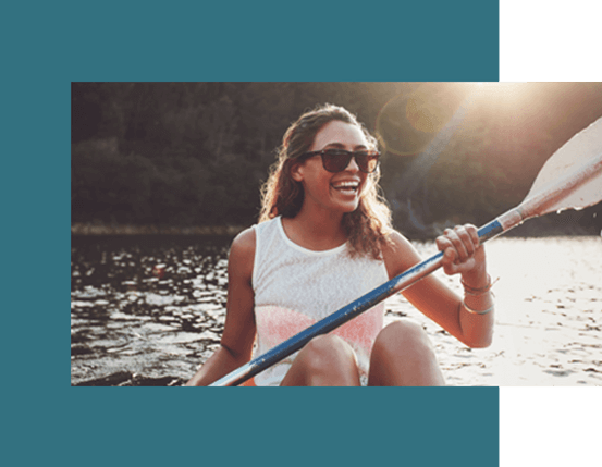 Woman with sunglasses canoeing